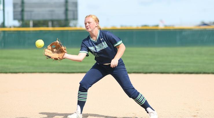 Softball player Kylie Kruger catching a softball in the infield